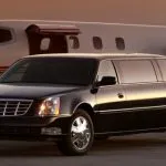 Limousine next to an airplane