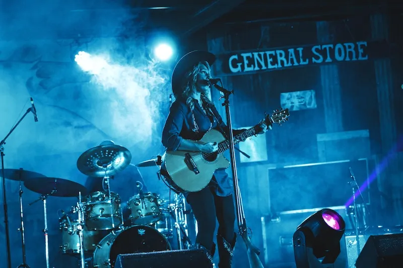 country music singer on stage in a smoky theater