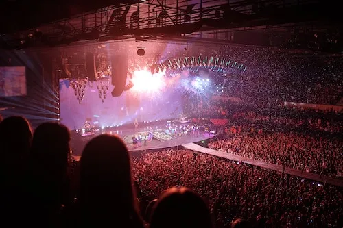 large stage with many people cheering
